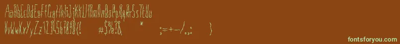 フォントAnoressic – 緑色の文字が茶色の背景にあります。