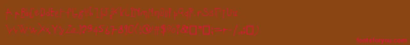 フォントCoulant – 赤い文字が茶色の背景にあります。