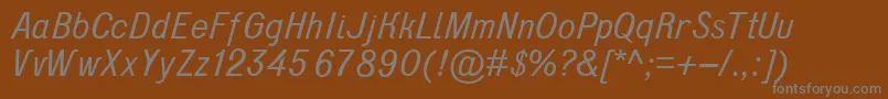 D431Italic-fontti – harmaat kirjasimet ruskealla taustalla