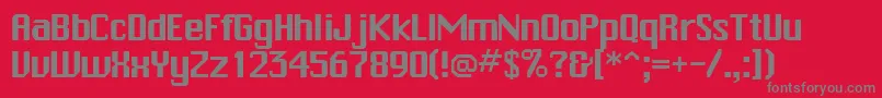 フォントTrakksskRegular – 赤い背景に灰色の文字