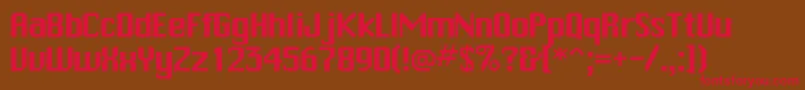 フォントTrakksskRegular – 赤い文字が茶色の背景にあります。