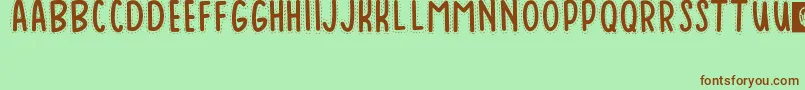 Baduy-Schriftart – Braune Schriften auf grünem Hintergrund