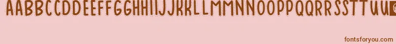 Baduy-Schriftart – Braune Schriften auf rosa Hintergrund