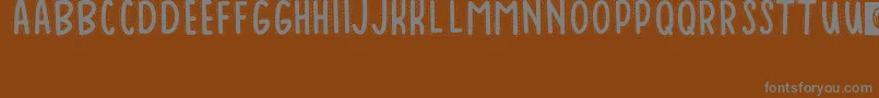 Шрифт Baduy – серые шрифты на коричневом фоне