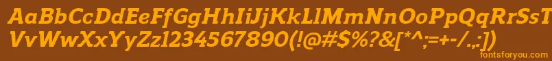 フォントReganslabExtrabolditalic – オレンジ色の文字が茶色の背景にあります。