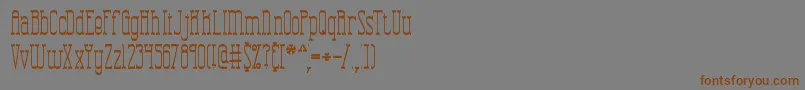 フォントCombustionTallBrk – 茶色の文字が灰色の背景にあります。