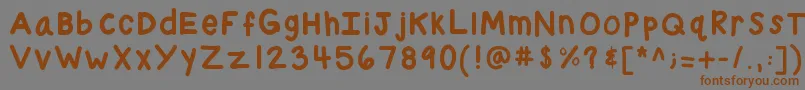 フォントKbchubby – 茶色の文字が灰色の背景にあります。