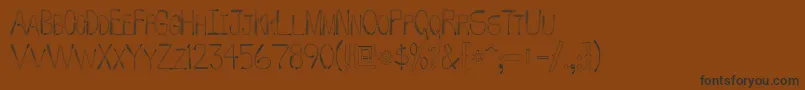 フォントWhipFont – 黒い文字が茶色の背景にあります