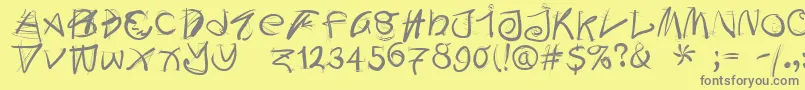 フォントDoodleswritten – 黄色の背景に灰色の文字