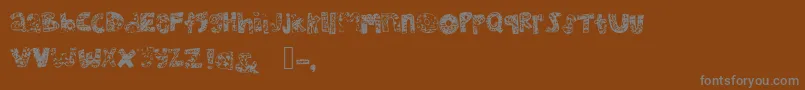 Mhvsunkisseddolphin-Schriftart – Graue Schriften auf braunem Hintergrund