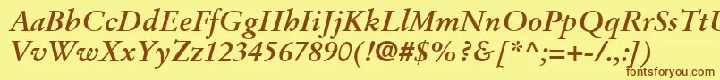 フォントStempelGaramondLtBoldItalic – 茶色の文字が黄色の背景にあります。