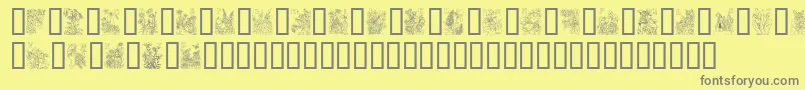 FlowerAndFairyAlphabet-fontti – harmaat kirjasimet keltaisella taustalla