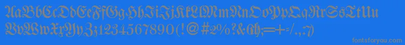 フォントWaggledbNormal – 青い背景に灰色の文字