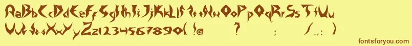 フォントTattooHeavy – 茶色の文字が黄色の背景にあります。
