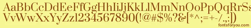 フォントPrataRegular – 茶色の文字が黄色の背景にあります。