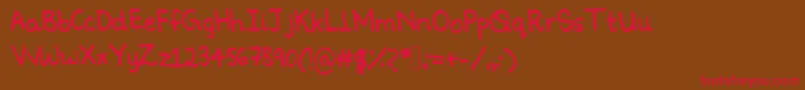 Ninoshandwriting Font – Red Fonts on Brown Background