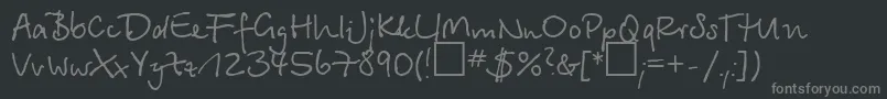 Czcionka Betinascript – szare czcionki na czarnym tle