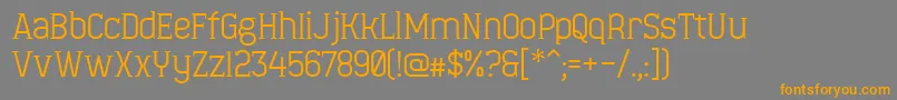 フォントMinaeffEct – オレンジの文字は灰色の背景にあります。