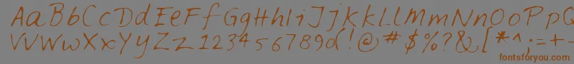 フォントFeltpen – 茶色の文字が灰色の背景にあります。