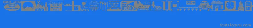 DecoPicsJl-fontti – harmaat kirjasimet sinisellä taustalla