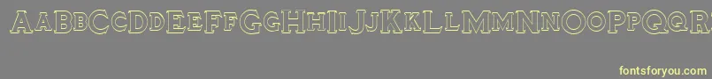 Tinplatetitling Font – Yellow Fonts on Gray Background