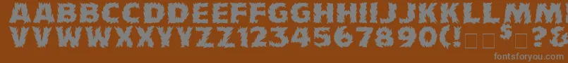 Fonte Firecat ffy – fontes cinzas em um fundo marrom