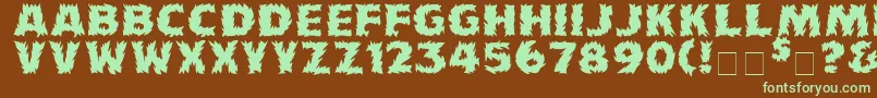 フォントFirecat ffy – 緑色の文字が茶色の背景にあります。