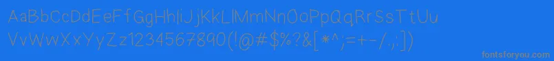 Fonte EkasAndroidHandwriting – fontes cinzas em um fundo azul
