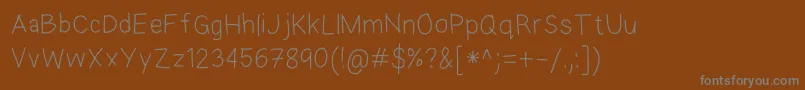 Шрифт EkasAndroidHandwriting – серые шрифты на коричневом фоне