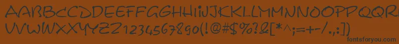 フォントPyxidiumRegular – 黒い文字が茶色の背景にあります
