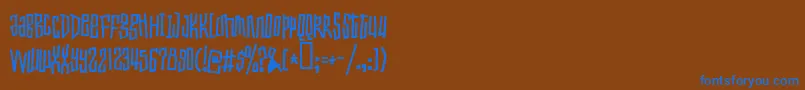 Toxicwaist Font – Blue Fonts on Brown Background