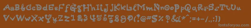 Fonte Hotsaucec – fontes cinzas em um fundo marrom
