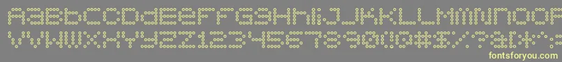 フォント5x5DotsOutline – 黄色のフォント、灰色の背景