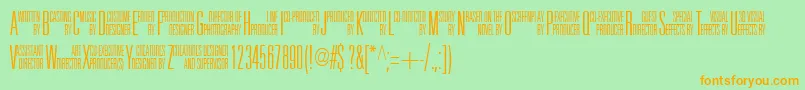 フォントUniAcc – オレンジの文字が緑の背景にあります。