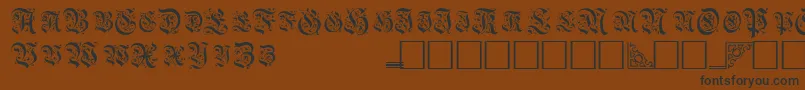 TopiascapssskRegular-fontti – mustat fontit ruskealla taustalla