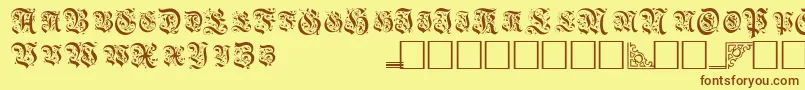 Шрифт TopiascapssskRegular – коричневые шрифты на жёлтом фоне