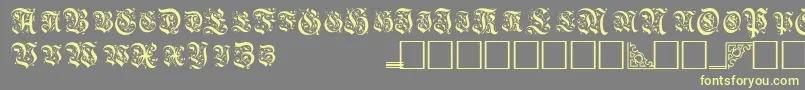 TopiascapssskRegular-Schriftart – Gelbe Schriften auf grauem Hintergrund