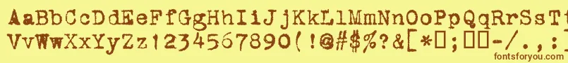 フォントVtcorona – 茶色の文字が黄色の背景にあります。