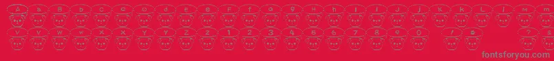 TKumaFont-Schriftart – Graue Schriften auf rotem Hintergrund