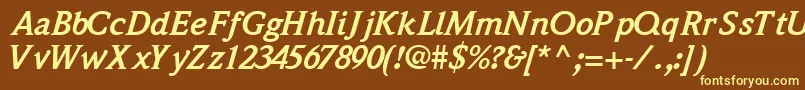 QuintessencesskBoldItalic-fontti – keltaiset fontit ruskealla taustalla