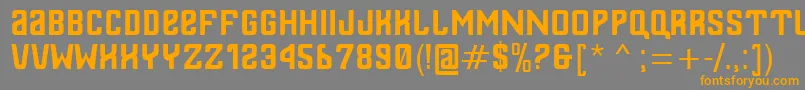 フォントThailandesa – オレンジの文字は灰色の背景にあります。