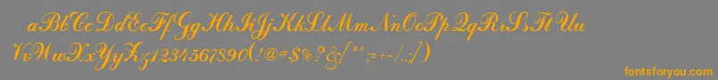 フォントOdessascriptRegular – オレンジの文字は灰色の背景にあります。