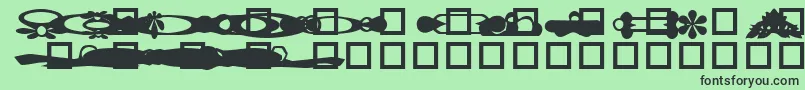 Czcionka GcDesignDingDingbat – czarne czcionki na zielonym tle