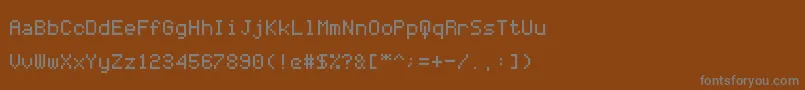 CodersCrux-Schriftart – Graue Schriften auf braunem Hintergrund