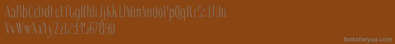 Fonte SoberbaserifRegular – fontes cinzas em um fundo marrom