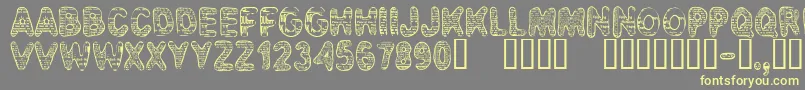 CfbadnewsRegular Font – Yellow Fonts on Gray Background