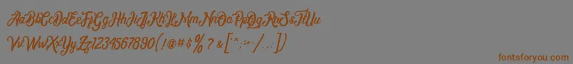 フォントMontrealdemo – 茶色の文字が灰色の背景にあります。