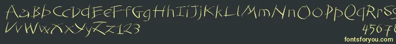 フォントTomahawked – 黒い背景に黄色の文字