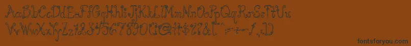 AustieBostYouWearFlowersHollow Font – Black Fonts on Brown Background