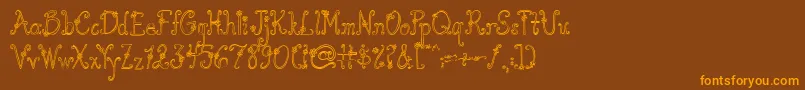 AustieBostYouWearFlowersHollow Font – Orange Fonts on Brown Background